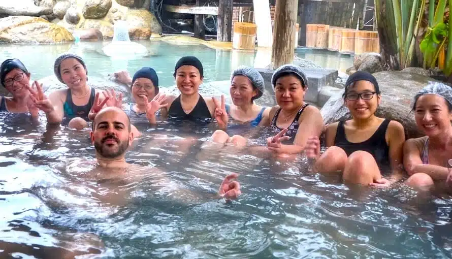 Retreat guests relaxing at a hot spring